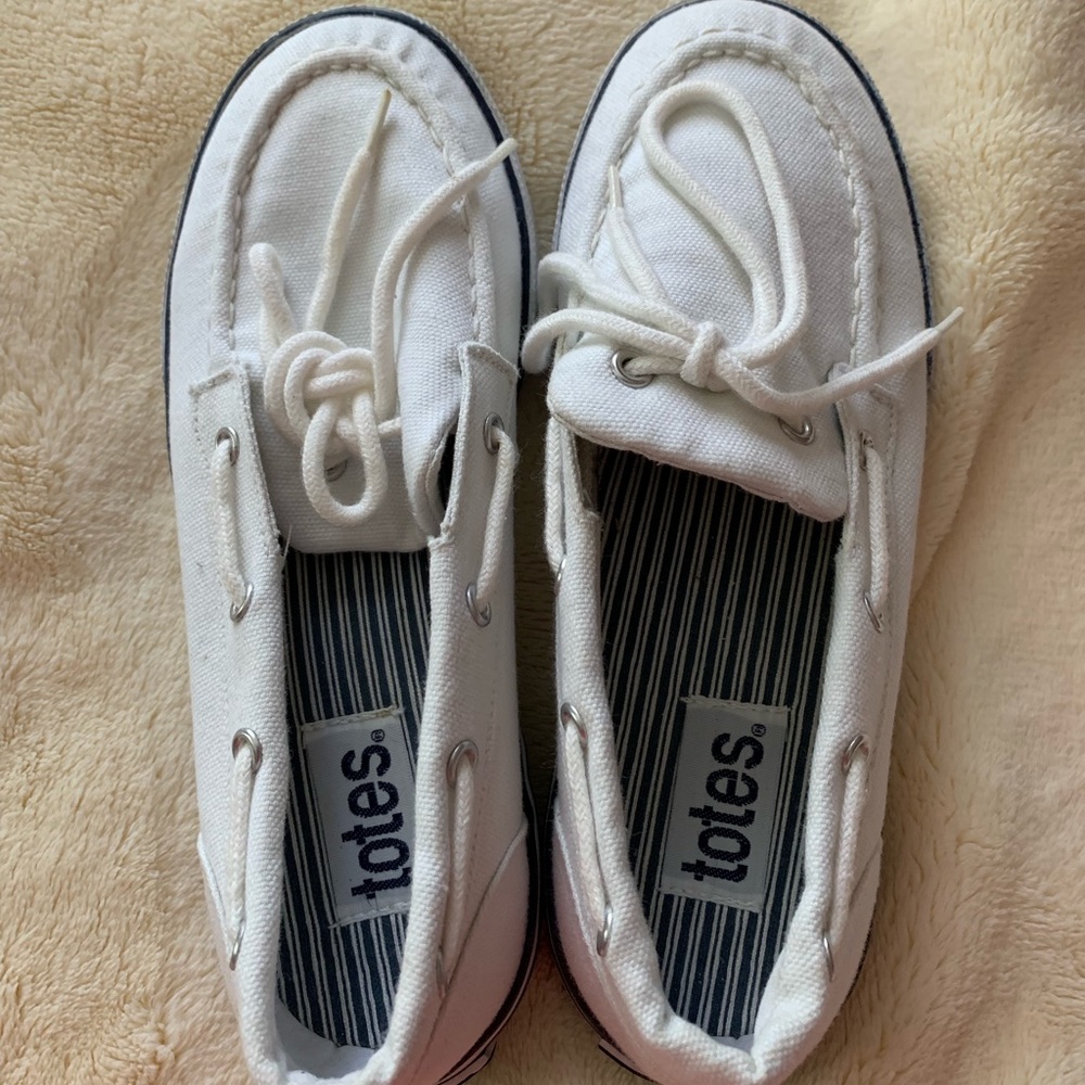 Women’s size 7 totes boat sneakers.  Never worn!!